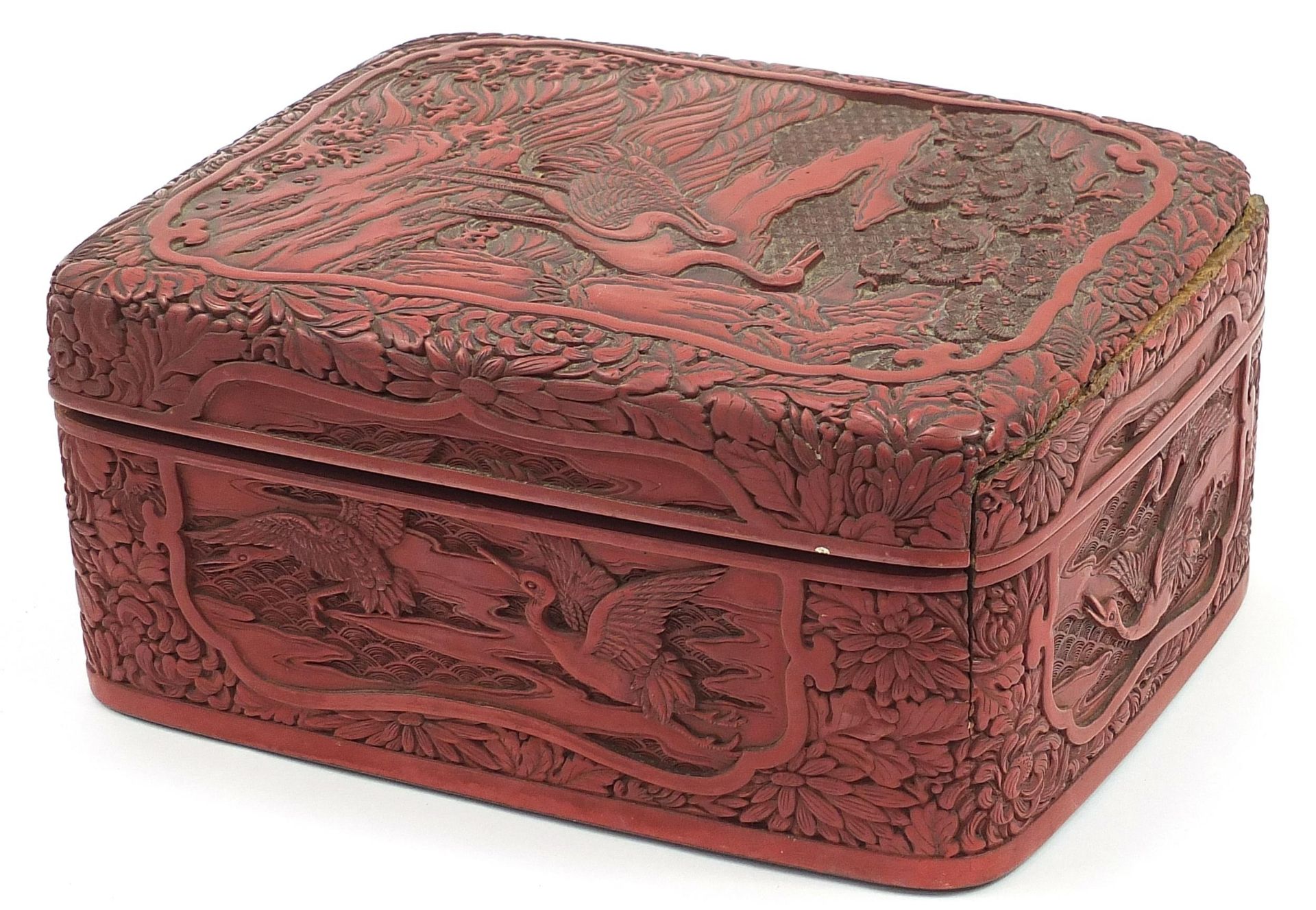 Large Chinese cinnabar lacquer box and cover carved with cranes in a landscape, 12cm H x 27.5cm W - Image 2 of 4