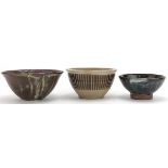 Three studio pottery bowls including examples by Tim Andrews and Kenneth Quick, each with
