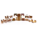 Wooden doll's house furniture including bureau, wardrobe and longcase clocks, the largest