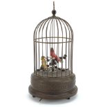 Early 20th century brass clockwork automaton musical bird cage, 28cm high