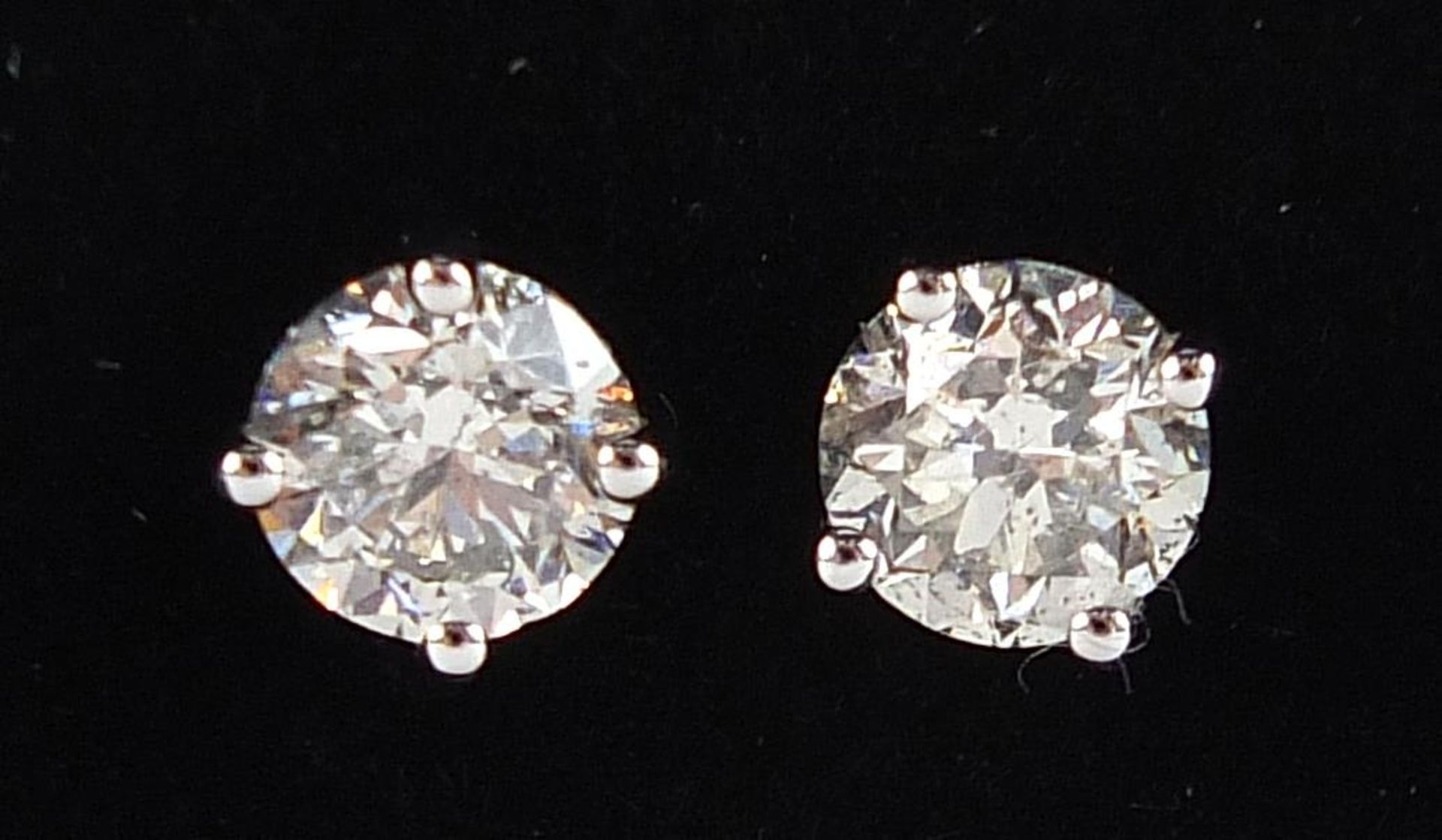 Pair of 18ct white gold diamond solitaire stud earrings, total diamond weight approximately 1.04 - Image 4 of 5