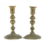 Pair of 18th century turned brass candlesticks, each 17.5cm high