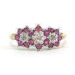 9ct gold ruby and diamond flower head ring, size R, 2.6g