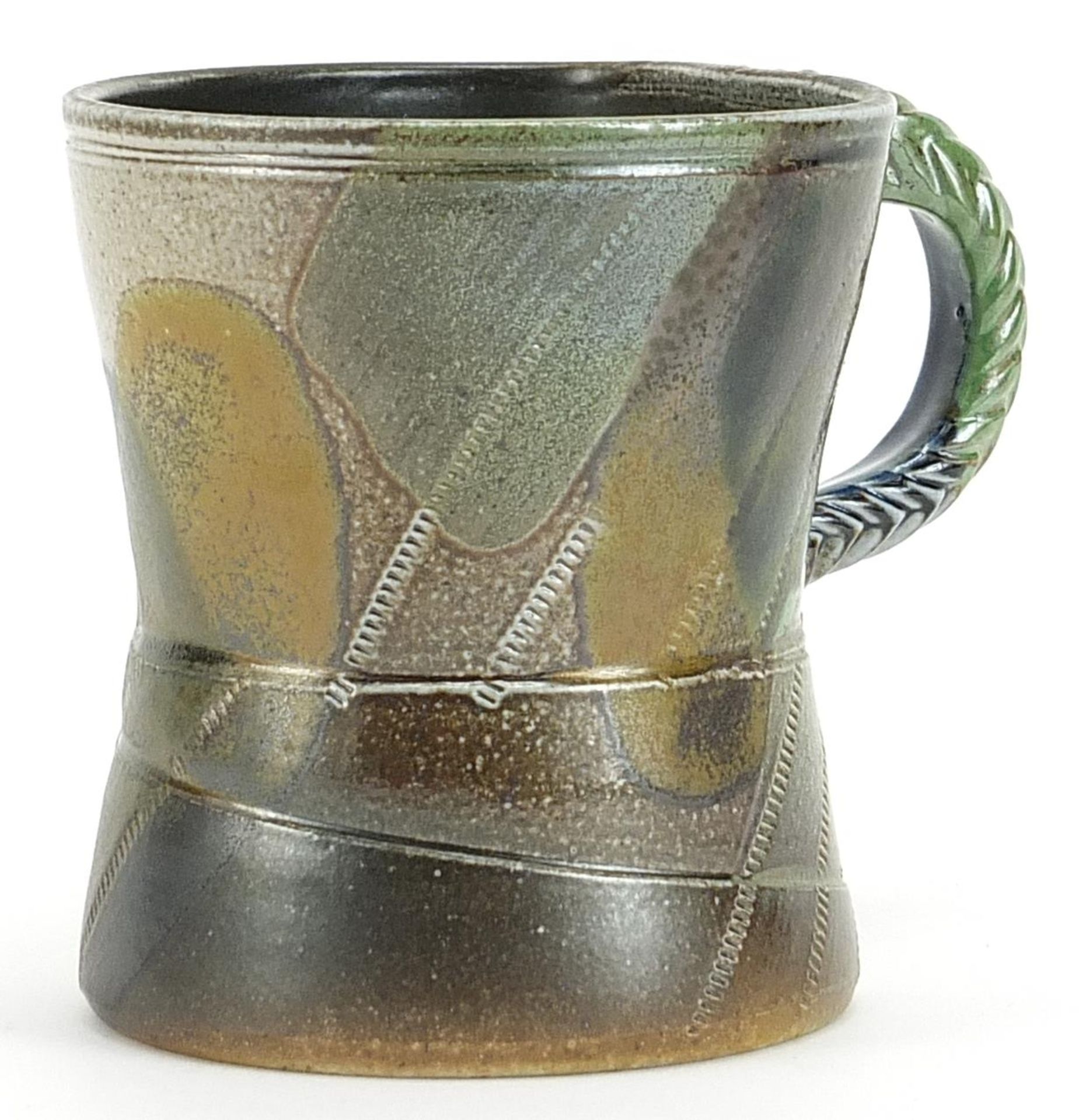 Jane Hamlyn, studio pottery mug having a salt glaze with incised decoration and impressed mark, 10cm