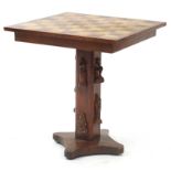 Hardwood chess table, the base with applied classical figures, 58.5cm H x 53cm W x 53cm D