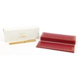 Must de Cartier gold plated and enamel ballpoint pen with fitted case, guarantee wallet and box, the