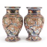 Pair of Japanese Imari porcelain vases with fluted bodies, finely hand painted and gilded with