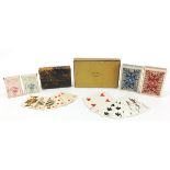 Four packets of vintage playing cards retailed by Hermes Paris and Lovegrove & Flint