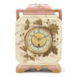 19th century aesthetic pottery mantle clock gilded with stylised flowers, the circular dial having