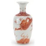 Chinese porcelain vase hand painted in iron red with a dragon chasing a flaming pearl amongst