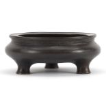 Chinese patinated bronze tripod incense burner, character marks to the base, 12.5cm in diameter