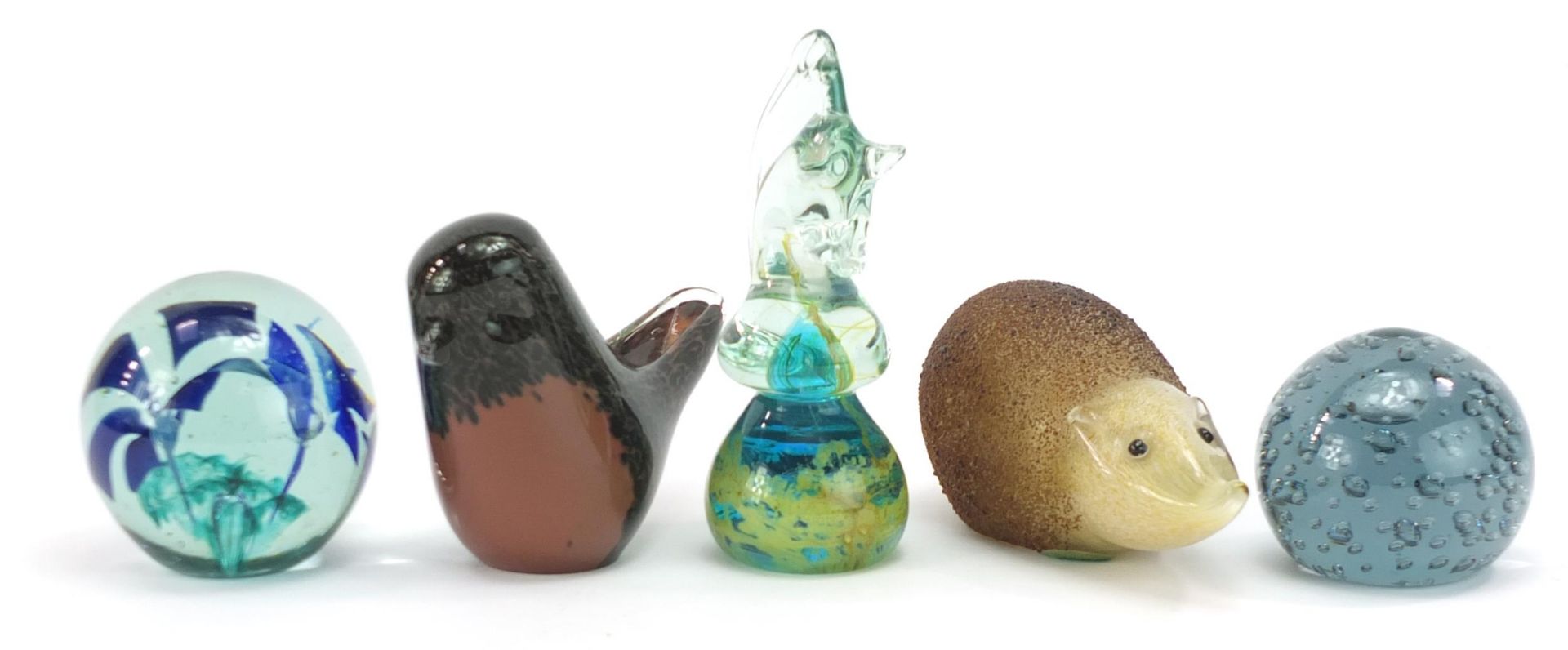 Five glass paperweights including one in the form of a hedgehog by Paul Miller for Langham, Wedgwood