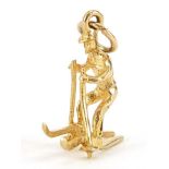 9ct gold man on skis charm, 1.6cm high, 1.1g