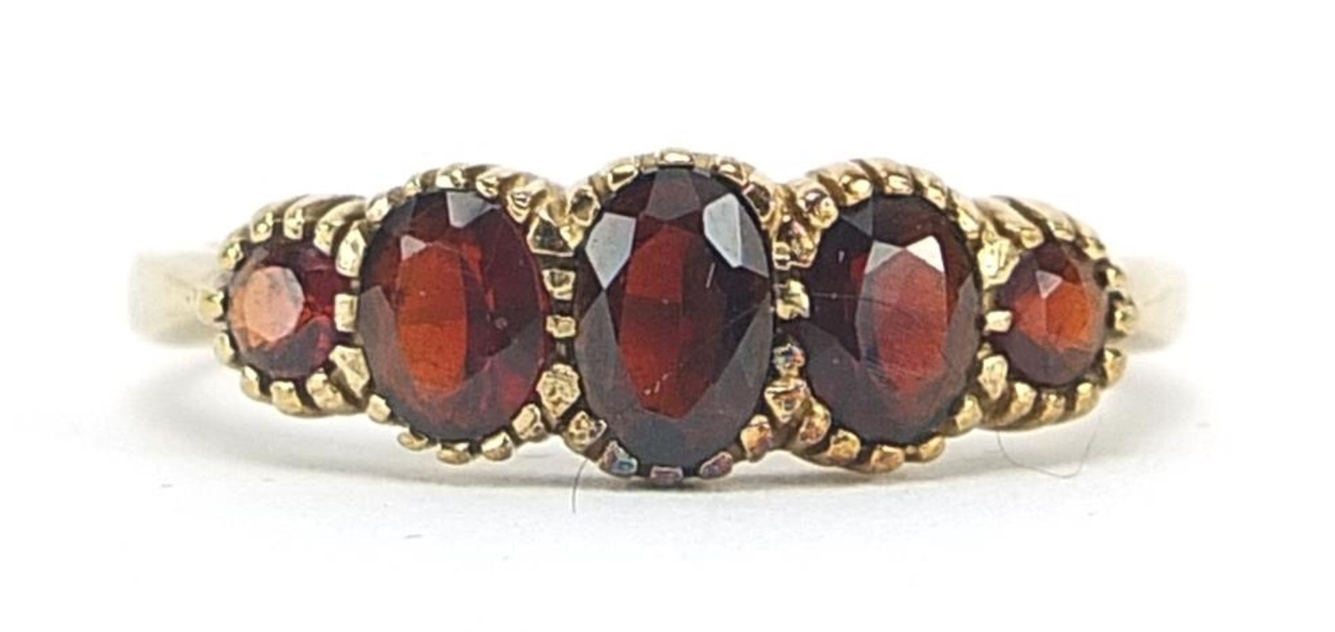 9ct gold garnet five stone ring, size S, 2.9g