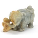 Chinese pale green and russet hardstone carving of two boys and an elephant, possibly jade, 15cm