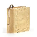 9ct gold holy bible charm opening to reveal folding pages, 1.4cm high, 2.2g