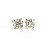 Pair of 18ct white gold diamond solitaire stud earrings, total diamond weight approximately 1.04