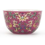 Chinese porcelain pink ground bowl hand painted in the famille rose palette with flower heads