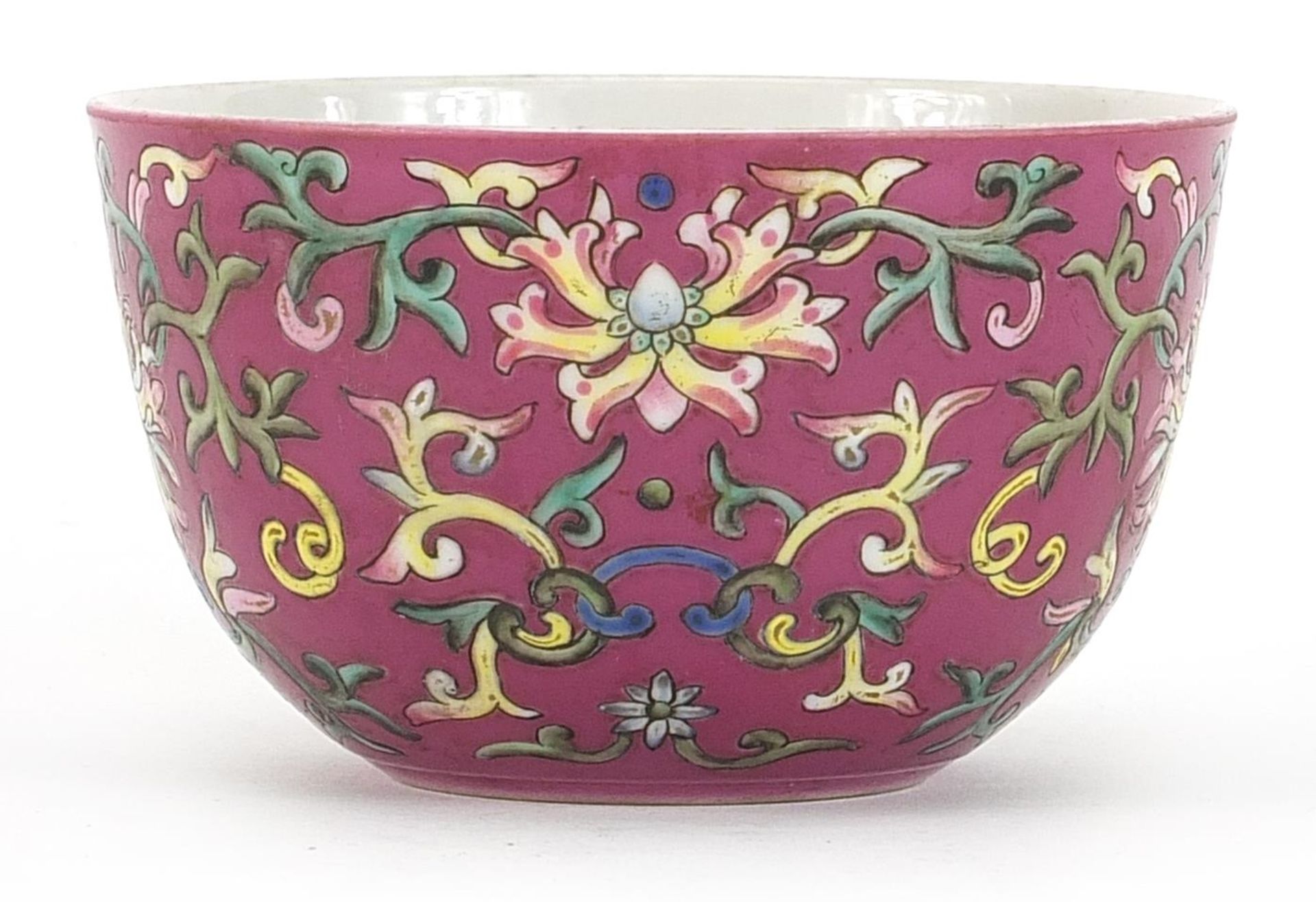 Chinese porcelain pink ground bowl hand painted in the famille rose palette with flower heads