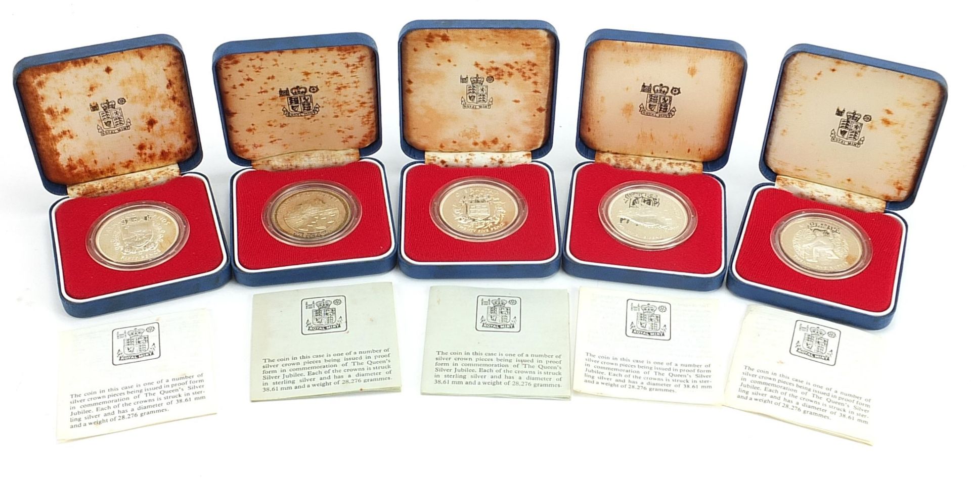 Five commemorative 1977 silver proof coins with cases including Gibraltar twenty five pence
