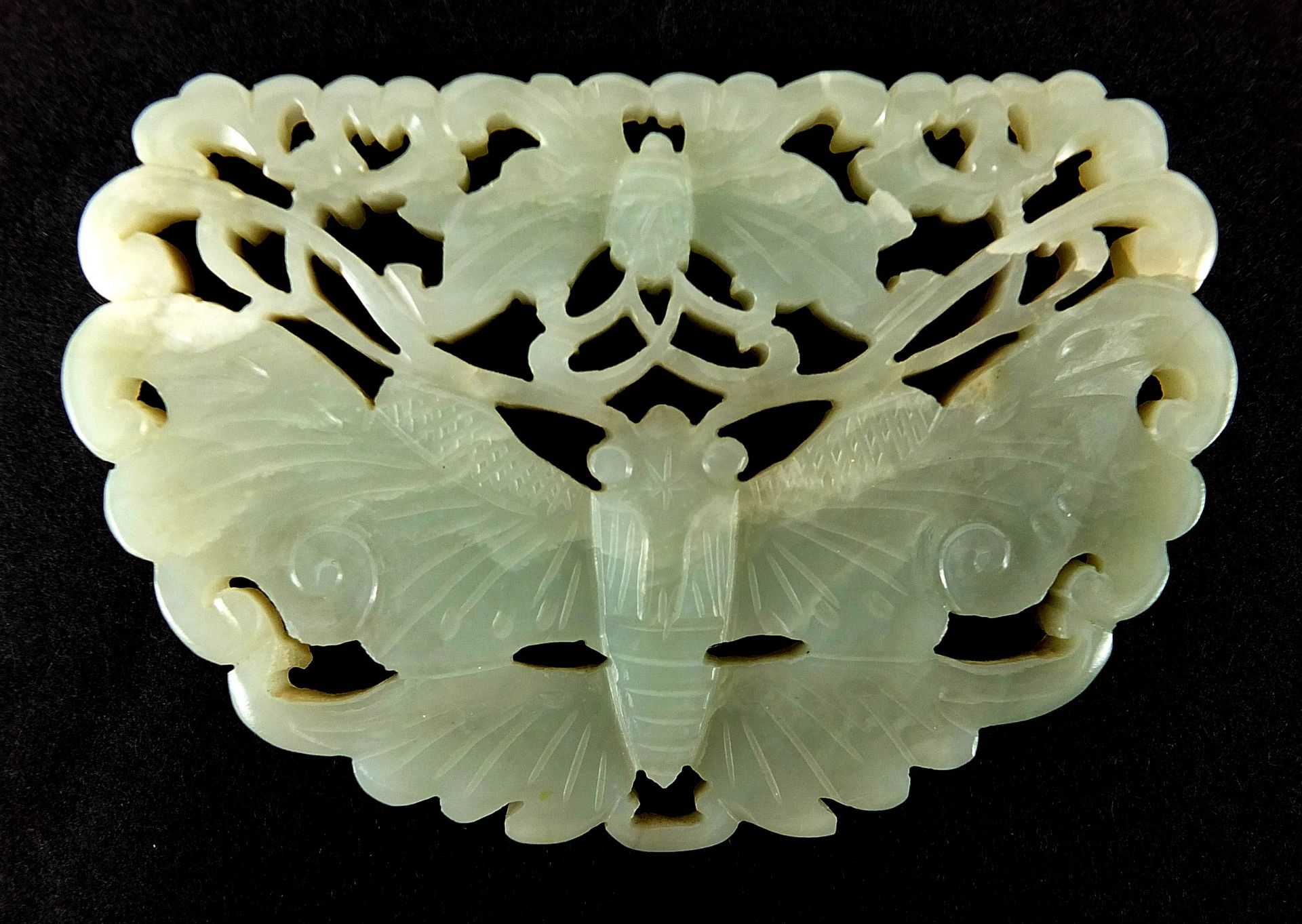 Chinese celadon and russet jade panel carved with two butterflies raised on carved hardwood stand, - Image 8 of 8