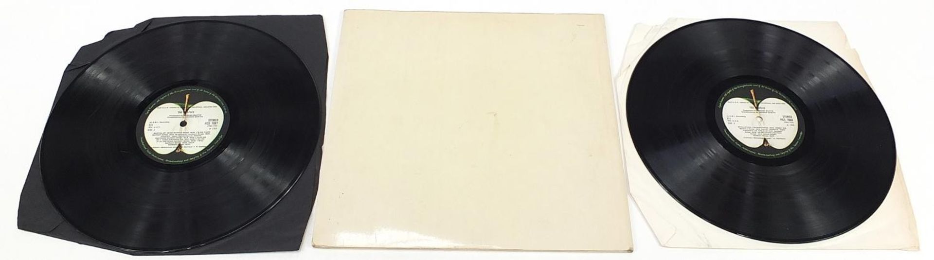 Four White Album vinyl LP records by The Beatles with posters and photographs comprising numbers - Image 15 of 17