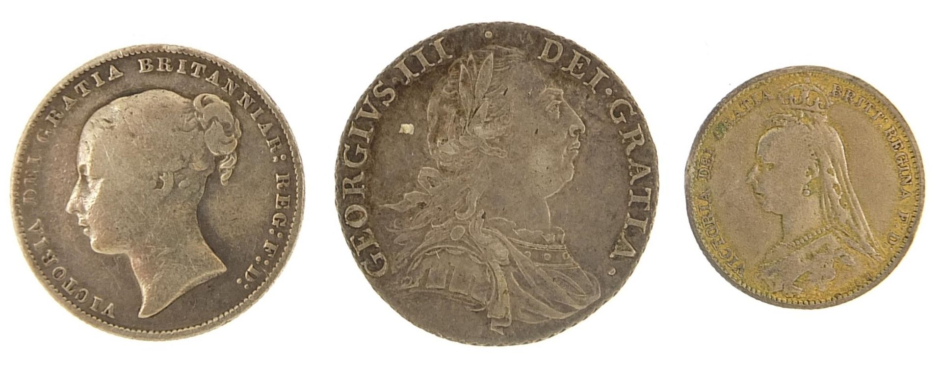 George III and later silver coinage comprising 1787 and 1867 shillings and an 1887 enamelled - Image 2 of 2