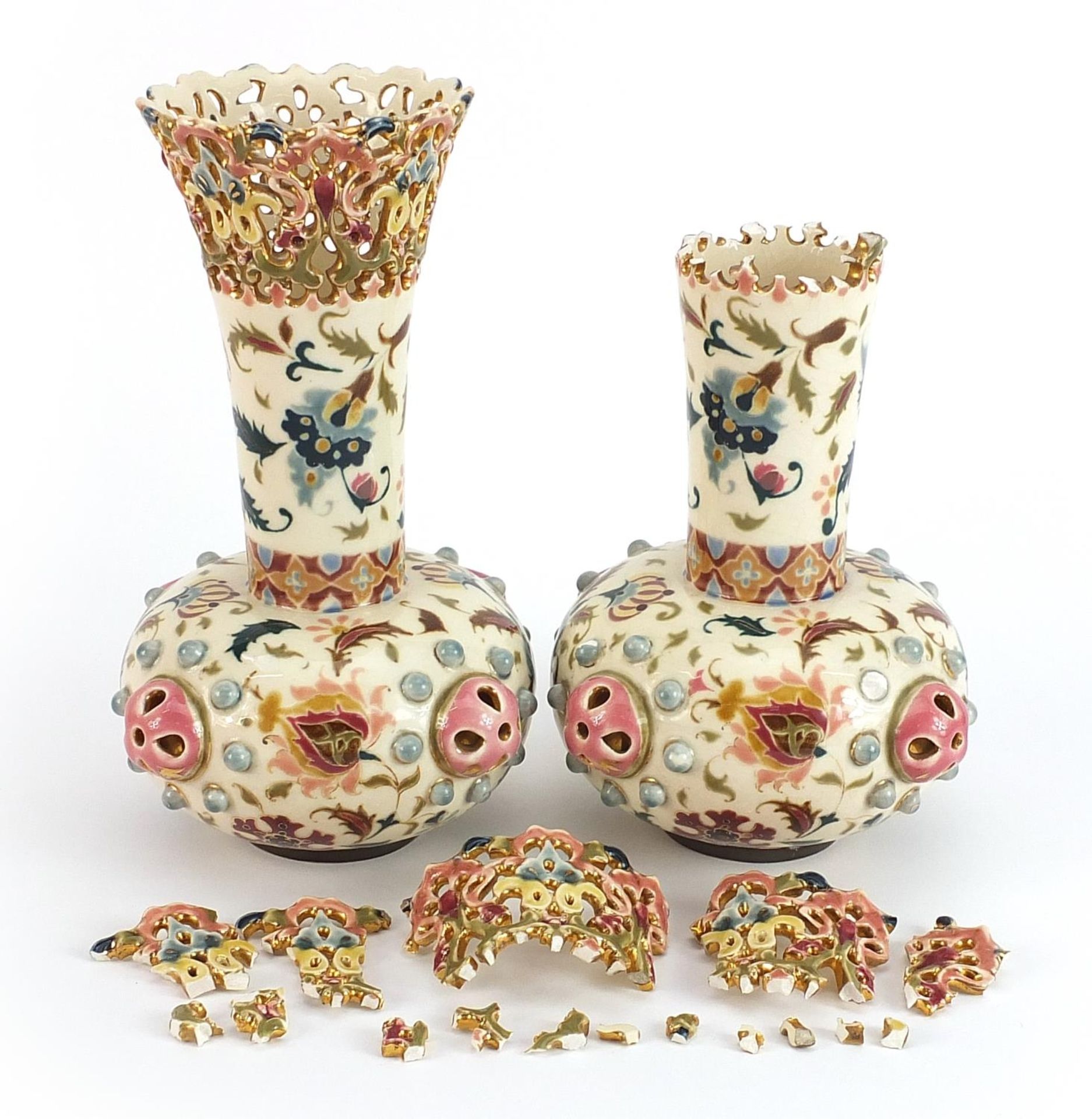 Zsolnay Pecs, pair of Hungarian pottery vases with pierced rims hand painted with stylised