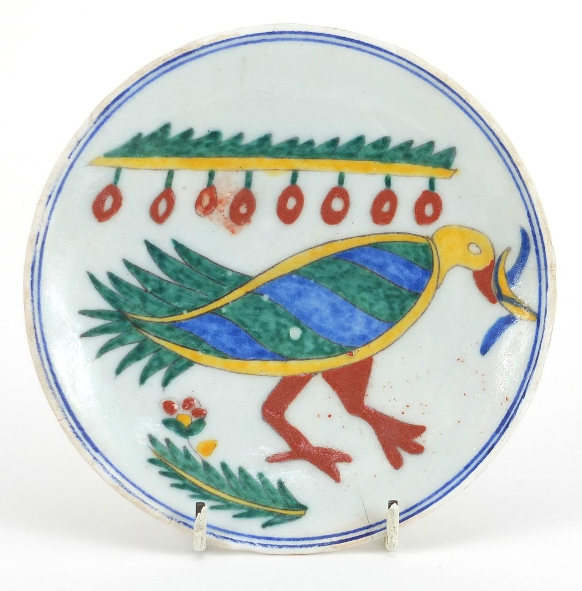 Turkish Kutahya pottery plate hand painted with a bird, 14.5cm in diameter