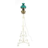 Vintage wrought iron floor standing adjustable oil lamp converted to electric use, overall 172cm
