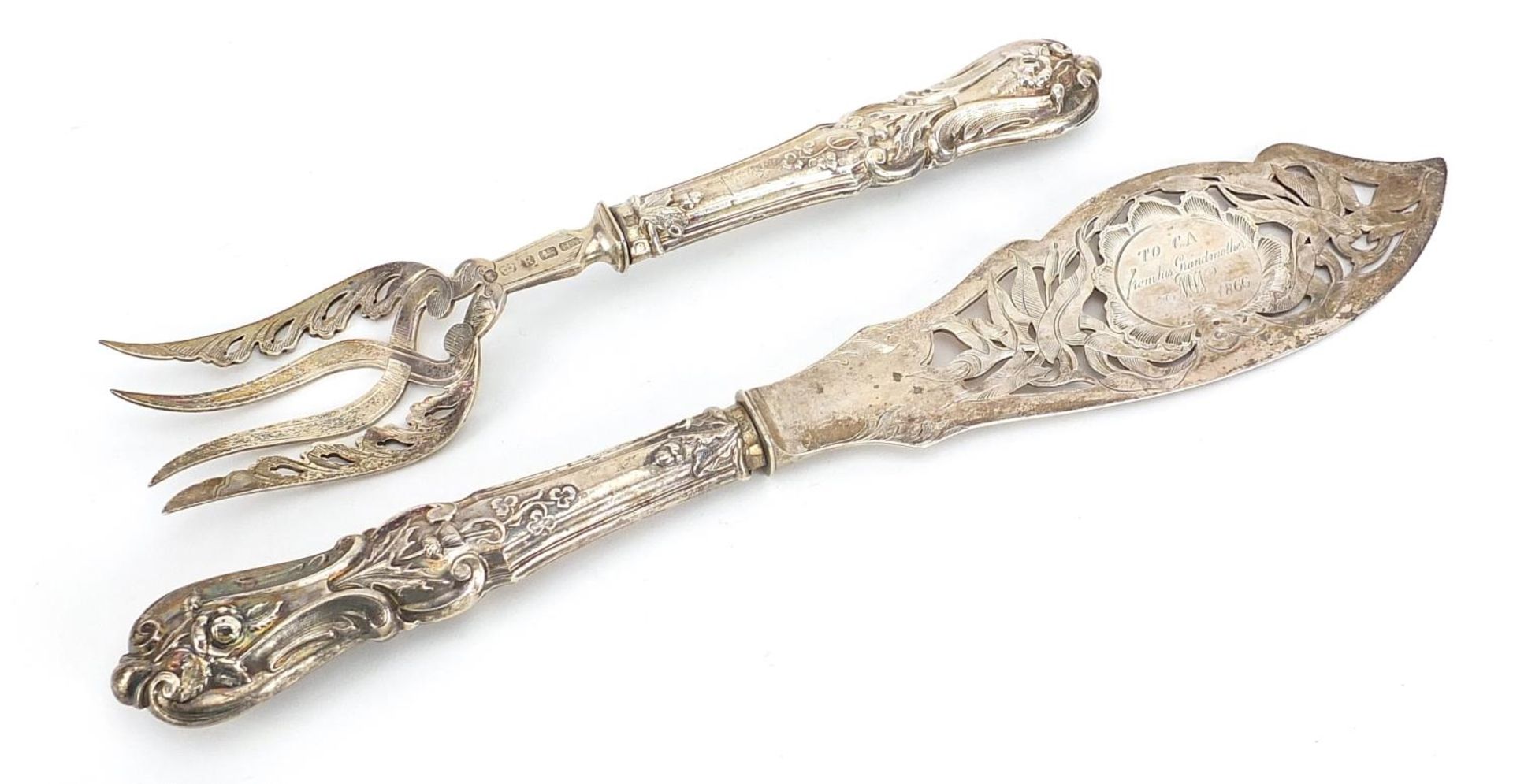 Henry Atkin Brothers, pair of Victorian silver fish servers, the knife engraved with a fisherman,