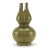 Large Chinese porcelain conjoined double gourd vase having a powdered green glaze, six figure