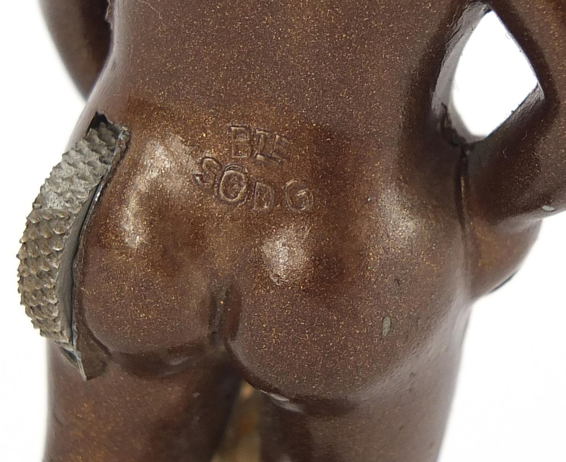 Novelty painted metal lighter in the form of a nude boy, marks to the reverse, 8cm high - Image 3 of 4