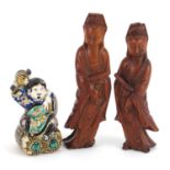 Pair of Chinese carved wood figures of Guanyin and a Japanese porcelain figure of a man holding a