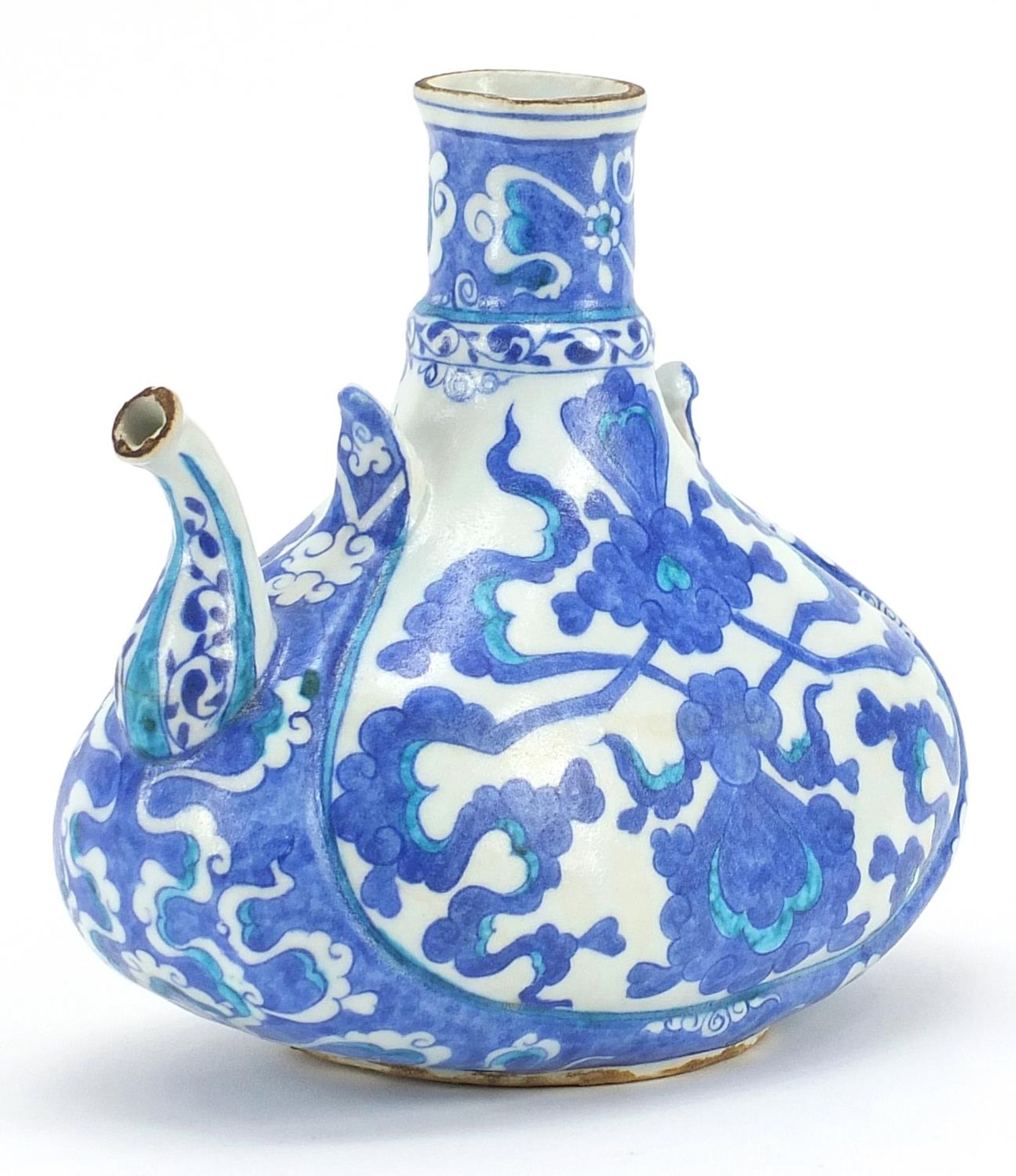Turkish Iznik pottery water jug hand painted with scrolling foliage, 17.5cm high