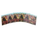 Five Sgt Pepper's Lonely Hearts Club Band vinyl LP records by The Beatles with cut outs, three