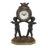 Champleve enamel and patinated spelter mantle clock with two Putti, the circular enamelled dial