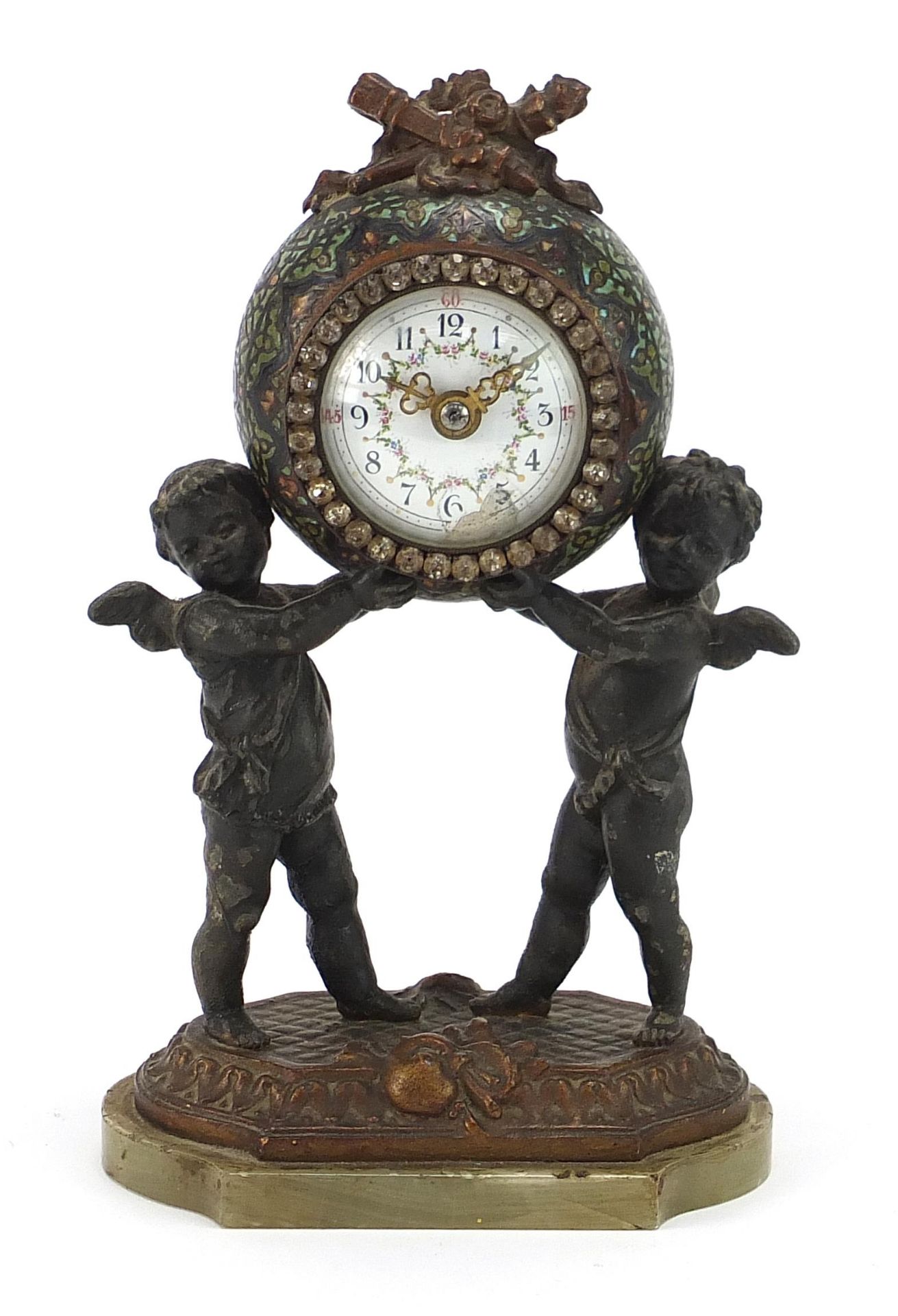 Champleve enamel and patinated spelter mantle clock with two Putti, the circular enamelled dial