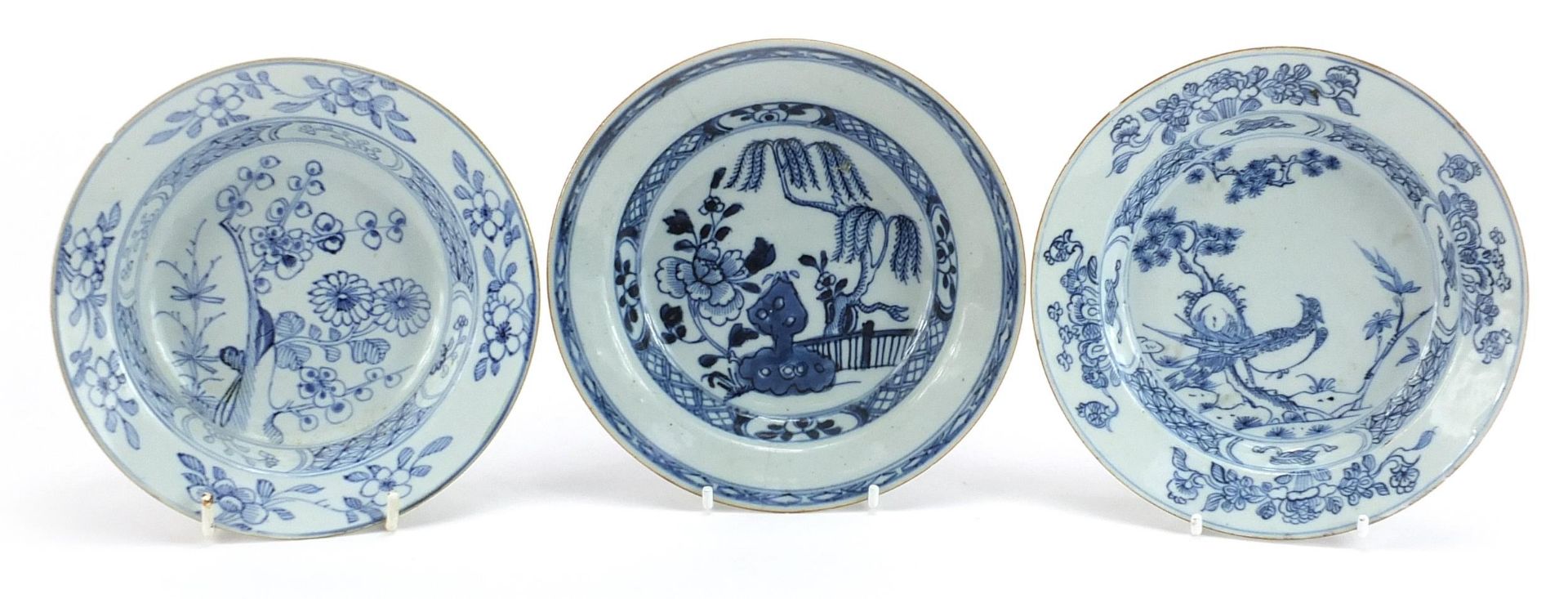 Three Chinese blue and white porcelain shallow bowls hand painted with flowers, each approximately