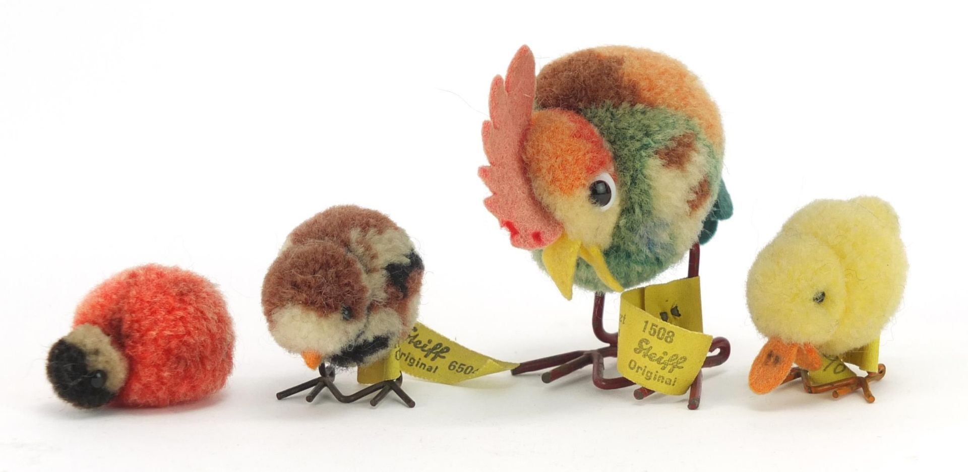 Three vintage Steiff chicks and a chicken, the largest 5.5cm high