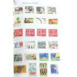 Collection of world stamps arranged in an album including Canada, Commonwealth and Great Britain