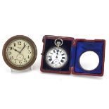 J C Vickery pocket watch housed in a leather travelling case with easel stand and an eight day clock