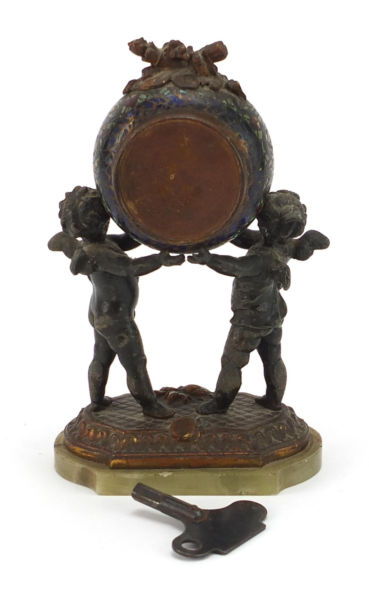 Champleve enamel and patinated spelter mantle clock with two Putti, the circular enamelled dial - Image 2 of 4