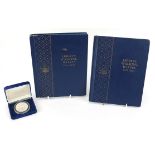 American coinage including Liberty Walking halves arranged in two albums and 1993 one ounce silver