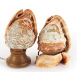 Two Italian conch shells including one carved with Mercury holding a caduceus and one with base