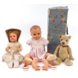 Two Rosebud and Pedigree vintage dolls and a golden articulated teddy bear, the largest 50cm high