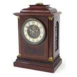 Inlaid mahogany bracket clock with columns and visible Brocot escapement, the circular enamelled