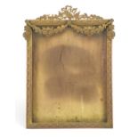 19th century gilt brass easel photo frame mounted with swags, impressed Stern Brothers New York to