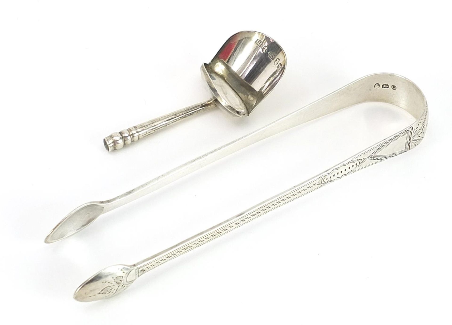 Georgian silver caddy spoon and pair of Georgian silver sugar tongs, both with incomplete hallmarks,