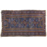 Rectangular blue ground rug having an all over geometric design, 192cm x 100cm